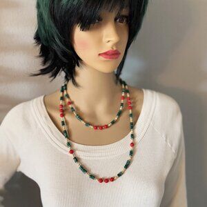 Long teal and red gemstone beaded necklace with golden accents